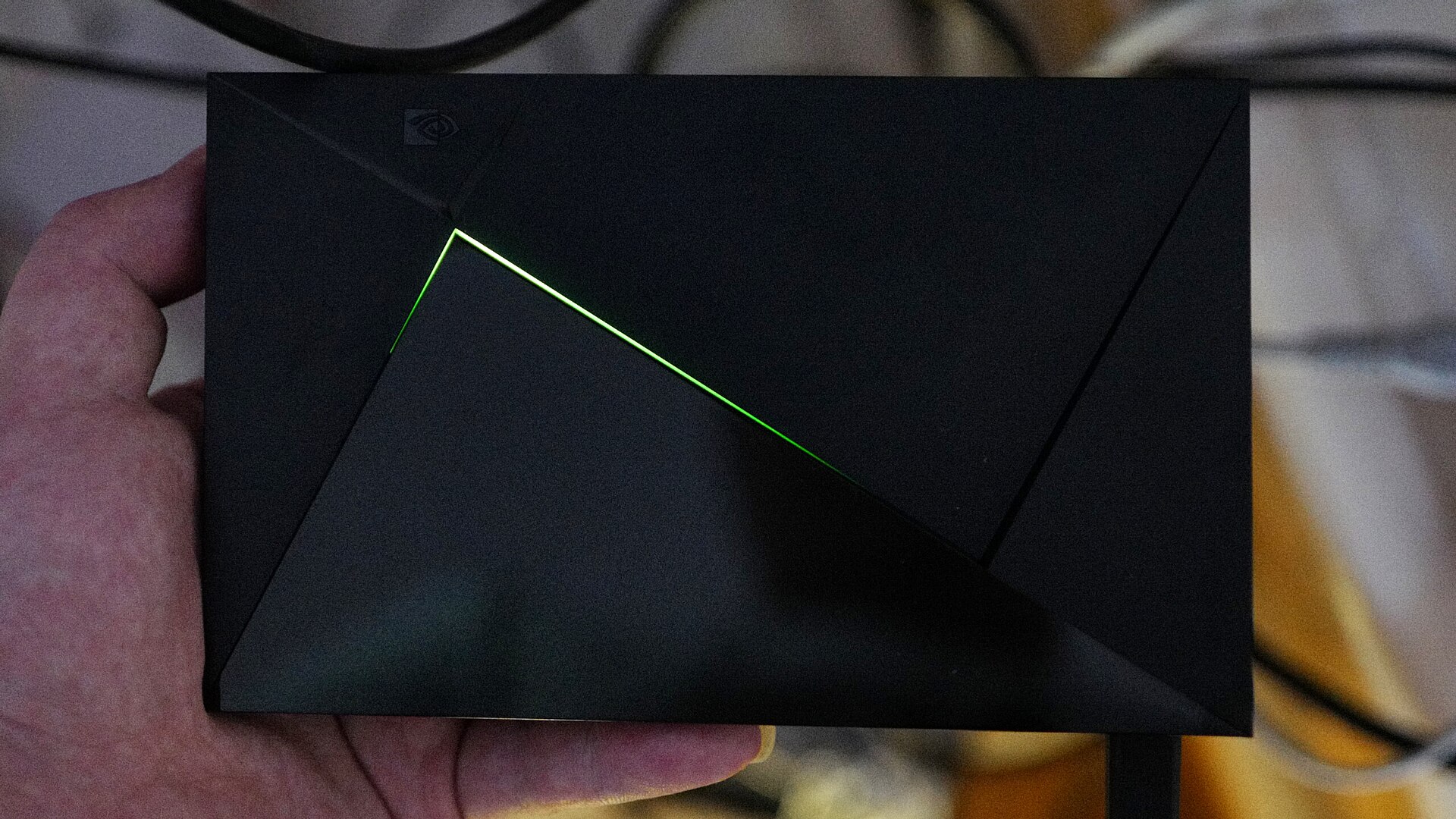 Android TV boxes like the Nvidia Shield work too. Their settings menus are laid out a little differently. An Nvidia Shield TV streaming box with its green light on
