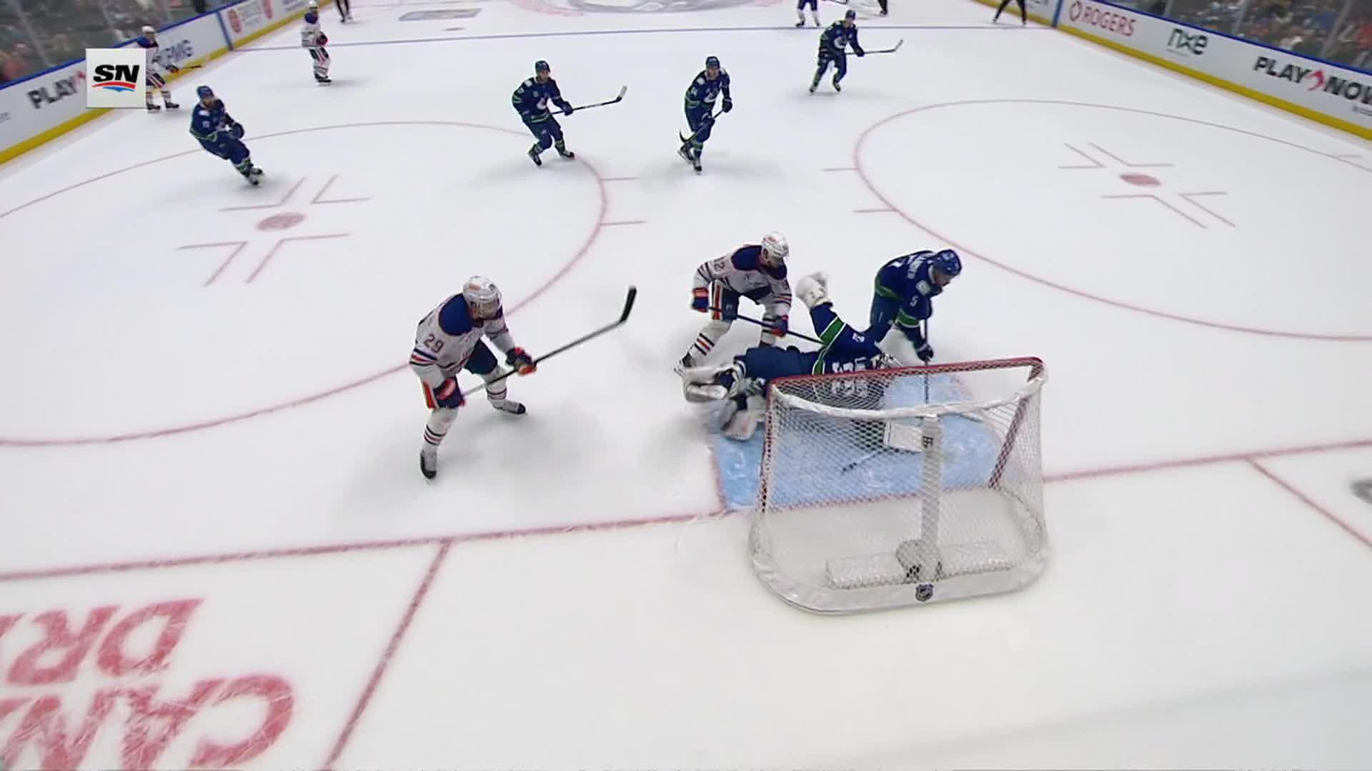 Evan Bouchard's goal was one of eight points he has in two games. Evan Bouchard scores for the Oilers in Vancouver